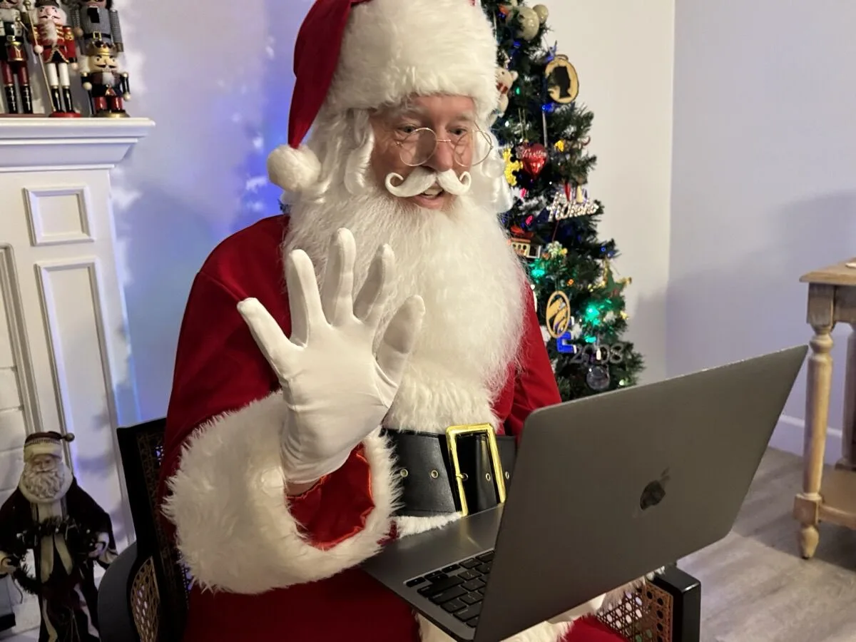 Santa waving hello on a video call